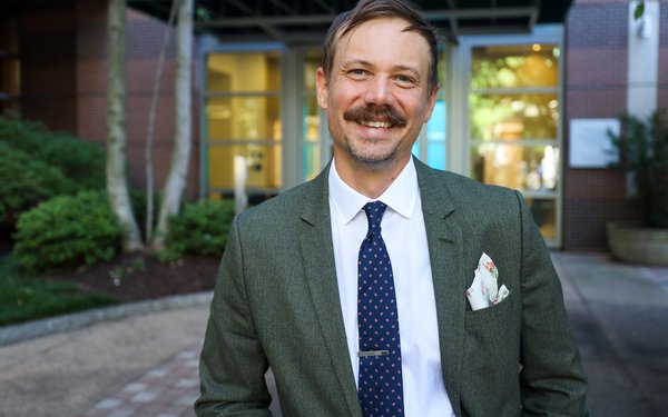 An image of Josh Fletcher in front of the Georgia Experience Center, Atlanta
